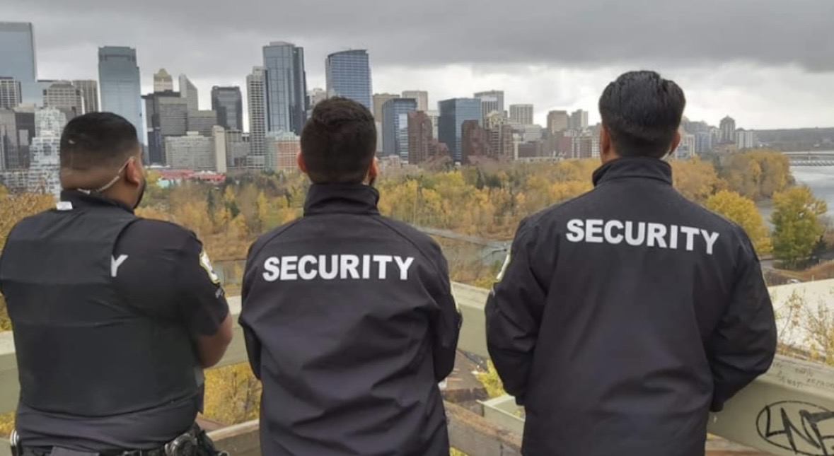 Enforcement Security officers on patrol overlooking Calgary skyline